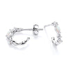 Silversmiths sterling silver huggie hoops with simulated opal wave design shown from side and front on white background.