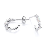 Silversmiths sterling silver huggie hoops with simulated opal wave design shown from side and front on white background.