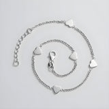 Sterling silver anklet with multiple heart-shaped stations and a secure clasp.