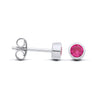 Sterling silver stud earrings with faceted simulated rubies in bezel settings, shown from the side and front.