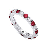 Sterling silver ring by Silversmiths features alternating simulated ruby and cubic zirconia in an eternity band design.