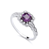 Sterling silver ring featuring a simulated amethyst center and cubic zirconia halo accents along the band.
