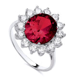 Sterling silver ring with an oval simulated ruby center, CZ accents, and a flower halo design by Silversmiths.