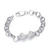 Sterling silver child’s bracelet with cubic zirconia boxing glove charm and lobster clasp on a white background.