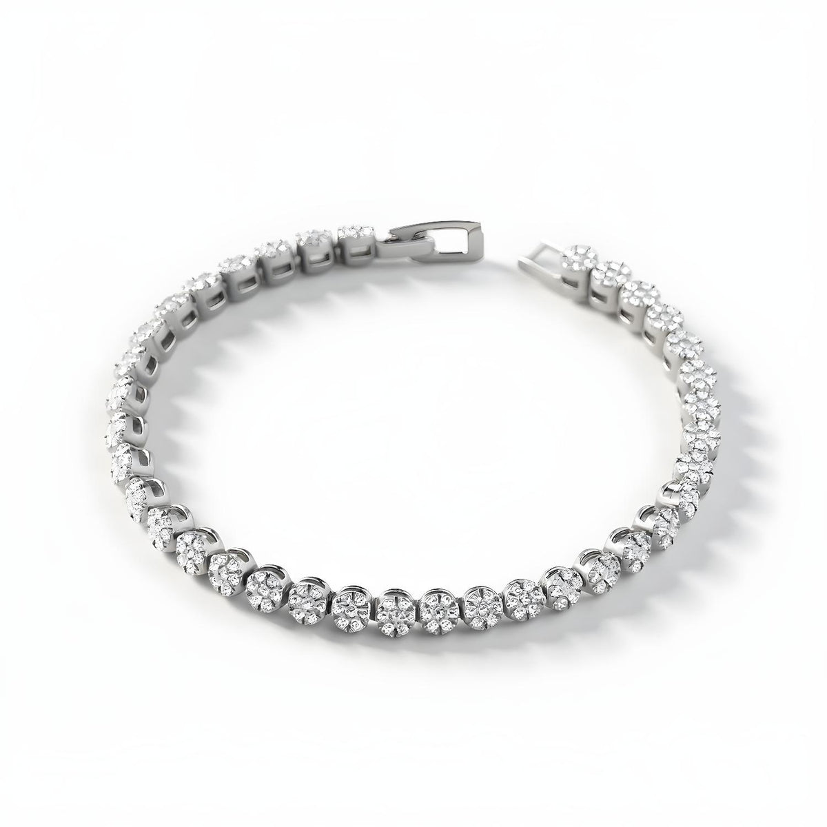A Silversmiths sterling silver tennis bracelet with cubic zirconia clusters is displayed against a white background.