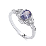 Sterling silver ring with simulated tanzanite and clear stones set in a twisted shank design.