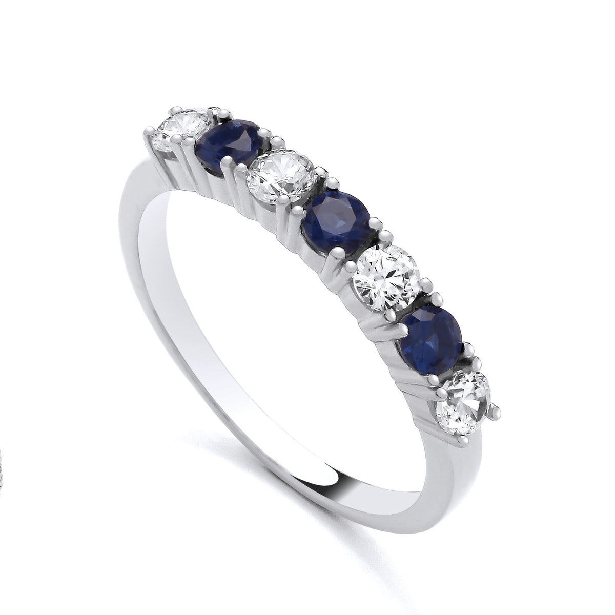 Sterling silver eternity ring featuring alternating simulated sapphires and cubic zirconia round stones.