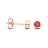 Rose gold plated silver studs with simulated garnet, displayed front and side on a white background.