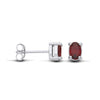 Sterling silver stud earrings feature oval natural garnets and butterfly backs, displayed from several viewpoints.