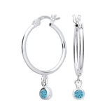 Sterling silver hoop earrings feature simulated London topaz stones in a classic design by Silversmiths.