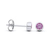 Silversmiths sterling silver stud earrings with simulated amethyst in bezel settings, shown front and side.