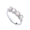 Sterling silver ring by Silversmiths featuring four oval simulated opals and cubic zirconia accents.