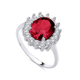 Sterling silver ring by Silversmiths featuring an oval simulated ruby and a CZ sunburst halo.