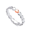 Sterling silver band ring by Silversmiths features a rose gold plated heart-shaped design.