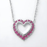 Sterling silver open heart necklace with simulated rubies and pink stones on a delicate chain.
