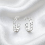 Silversmiths Sterling Silver 23mm chain link hoop earrings displayed on white fabric.