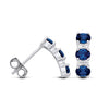 Silversmiths sterling silver drop stud earrings with simulated sapphire and CZ, shown from front and side views.