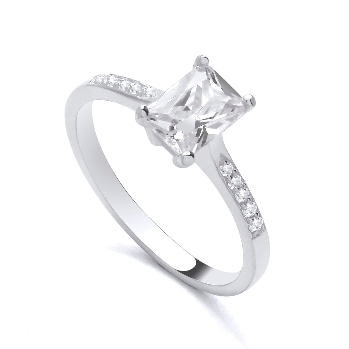 Sterling silver ring by Silversmiths with a 7x5mm emerald-cut cubic zirconia solitaire and accent stones.