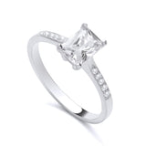 Sterling silver ring by Silversmiths with a 7x5mm emerald-cut cubic zirconia solitaire and accent stones.