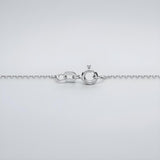 Silversmiths Sterling Silver 1mm diamond cut rolo chain necklace with spring ring clasp shown on a gray background.