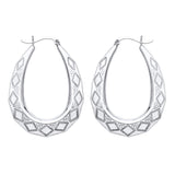 Silversmiths 40mm sterling silver oval Creole earrings feature diamond-cut and engraved detailing.
