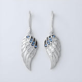 Sterling silver drop earrings with simulated sapphire stones and angel wing design by Silversmiths.