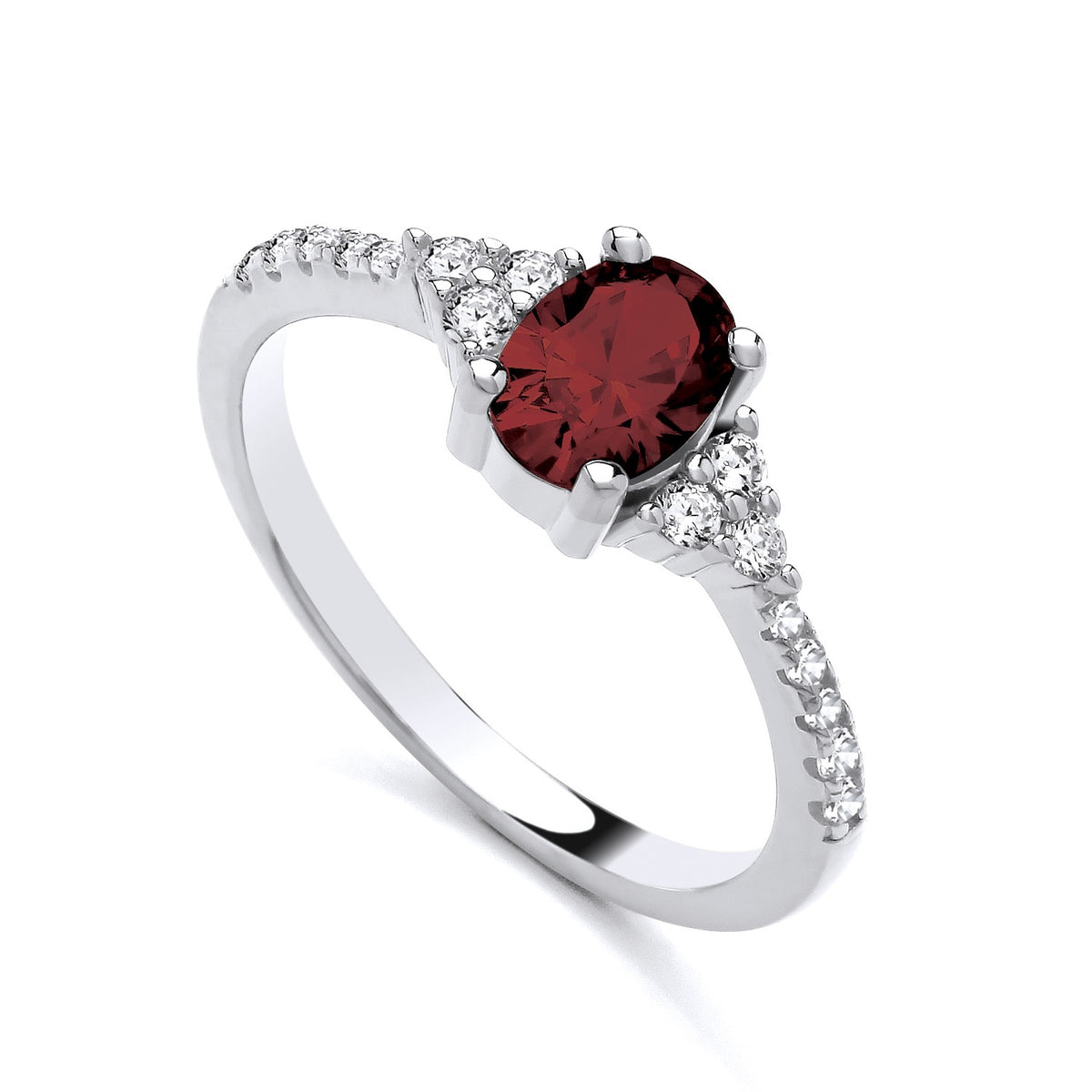 Sterling silver ring by Silversmiths featuring an oval simulated ruby and pavé accents along a smooth, slim band.