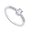 Sterling silver ring by Silversmiths featuring an oval cubic zirconia solitaire and accent stones along the band.