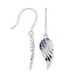 Silversmiths sterling silver angel wing drop earrings with simulated sapphires, shown from the side and front.