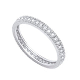 Sterling silver eternity ring featuring round-cut cubic zirconia and detailed milgrain edging by Silversmiths.