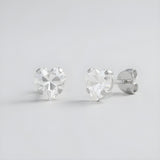 Silversmiths sterling silver 6mm heart-cut cubic zirconia studs displayed from front and side on a plain background.