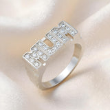 The Silversmiths ring features sterling silver and cubic zirconia with the word “MUM” on the front.