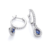 Sterling silver hoop earrings with simulated sapphire teardrop accents and clear stones.