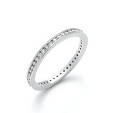 Silversmiths’ sterling silver eternity ring has round cut CZ stones channel set along a smooth, polished band.