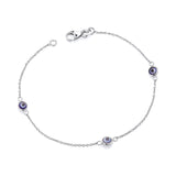 Sterling silver bracelet with three evil eye stations and a lobster clasp.