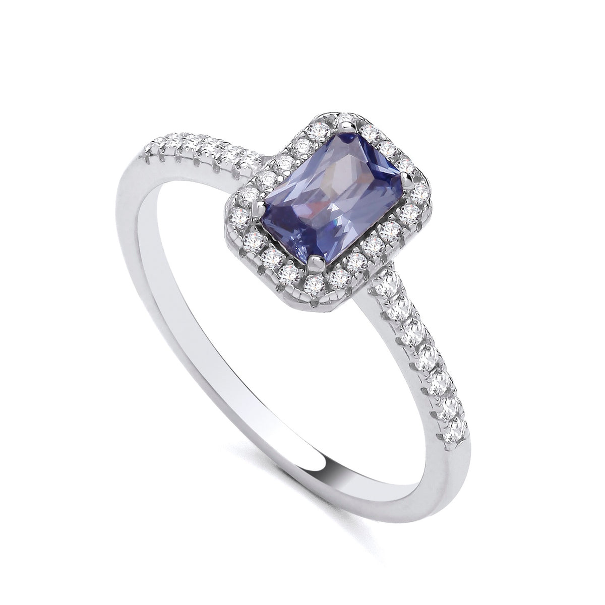 Sterling silver ring featuring a simulated tanzanite and CZ cluster with accents along the band.