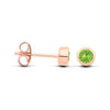 Rose gold plated silver stud earrings with simulated peridot are shown from the front and side on a white background.
