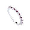 Sterling silver eternity ring featuring simulated rubies and cubic zirconia in a continuous stacker design.