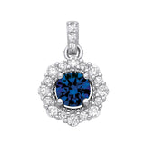 Sterling silver pendant with a simulated sapphire center and CZ stones forming a floral-shaped halo.