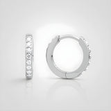 Sterling silver huggie hoop earrings with channel-set cubic zirconia, shown against a white background.