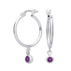 Sterling silver hoop earrings by Silversmiths feature simulated amethyst charms in a vibrant purple shade.