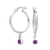 Sterling silver hoop earrings by Silversmiths feature simulated amethyst charms in a vibrant purple shade.