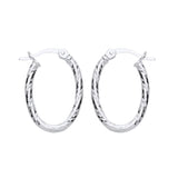 21mm sterling silver oval hoop earrings with diamond-cut finish and hinged clasps on a white background.