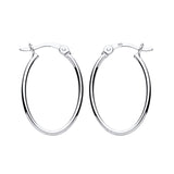 Sterling silver 22mm oval hoop earrings with latch backs, photographed on a plain white background.