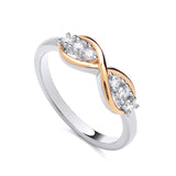 Gold plated sterling silver infinity ring featuring clear cubic zirconia stones and gold-toned accents.