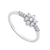 Sterling silver ring with a cluster of cubic zirconia set in a daisy floral pattern on a slim band.