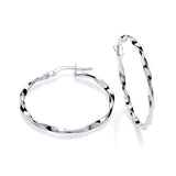A pair of 30mm sterling silver twist hoop earrings, one lying flat and one upright, on a white background.