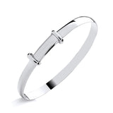 A sterling silver expanding baby bangle with a D-shaped profile is displayed against a white background.